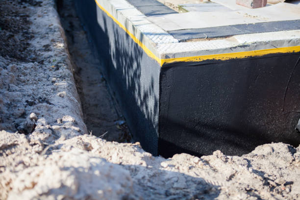 Professional Basement Waterproofing technician working in Unicoi, TN